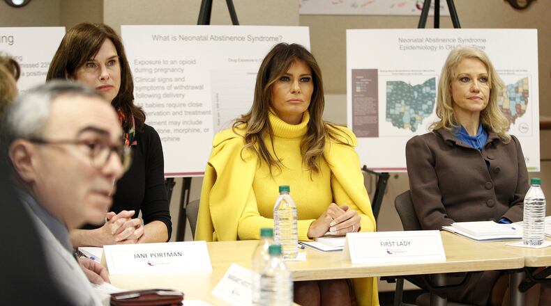 First Lady Melania Trump, Jane Portman, wife of Sen. Rob Portman, and Kellyanne Conway, counselor to the president, take part in an informational gathering on the opioid crisis at Cincinnati Children’s Hospital Monday. LISA POWELL/STAFF