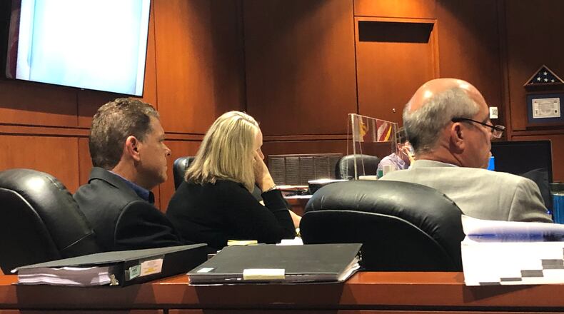 At left, Timothy Hall, an ex-Realtor based in Springboro, listens Wednesday during his trial in Warren County Common Pleas Court.