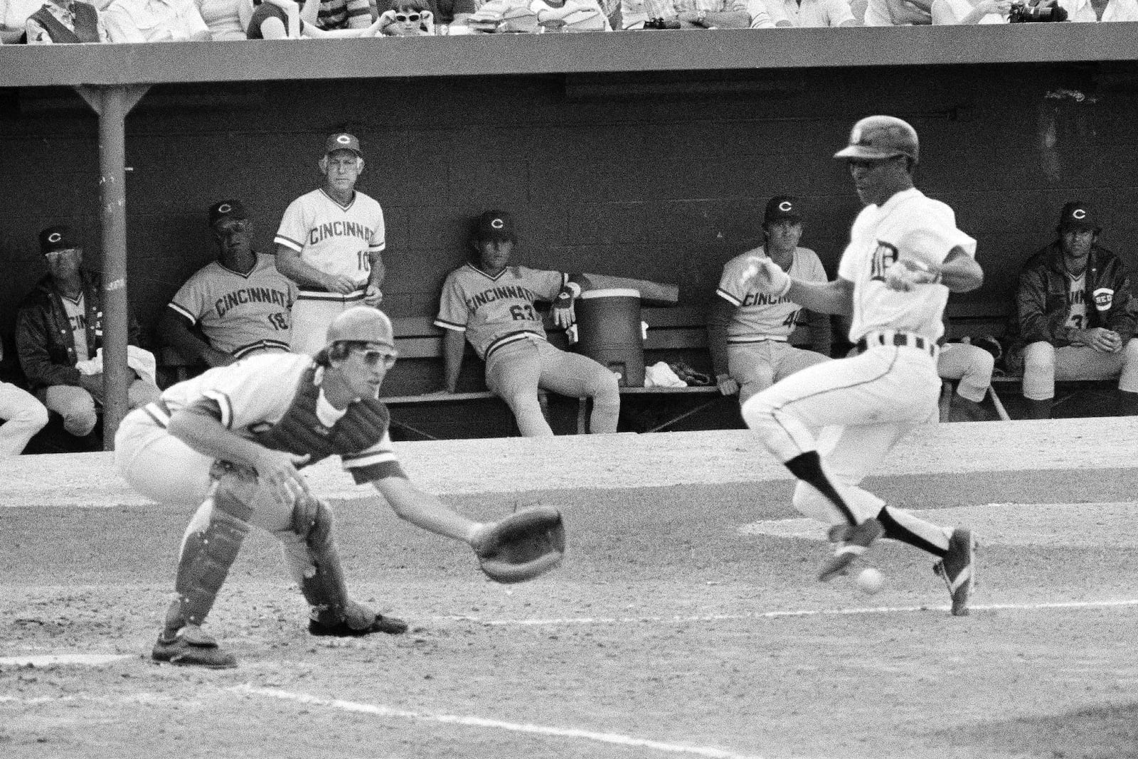 Detroit Tigers' Lou Whitaker slides into the plate to score from third as Cincinnati Reds catcher Bill Plummer reaches for the ball during the second inning of a spring training baseball game in Lakeland, Fla., March 20, 1978. (AP Photo/Preston Stroup, File)