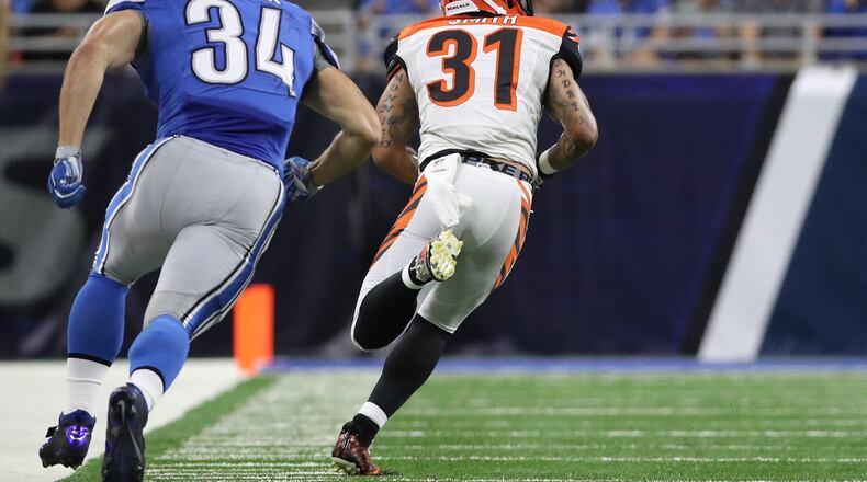 DETROIT, MI - AUGUST 18: Derron Smith #31 of the Cincinnati Bengals makes the pickoff of the pass from Dan Orlovsky (not in photo) and runs for a second quarter touchdown during the preseason game against the Detroit Lions at Ford Field on August 18, 2016 in Detroit, Michigan. (Photo by Leon Halip/Getty Images)