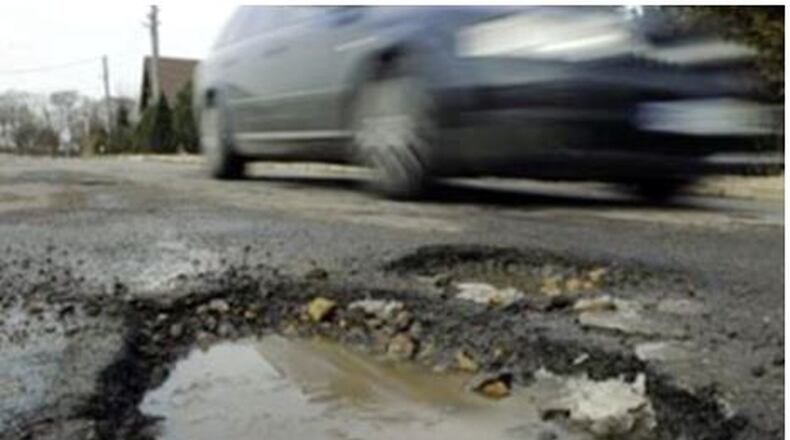 Damage from hitting potholes is why motorists need to watch for three warning signs to help determine if their vehicle has been damaged. File photo