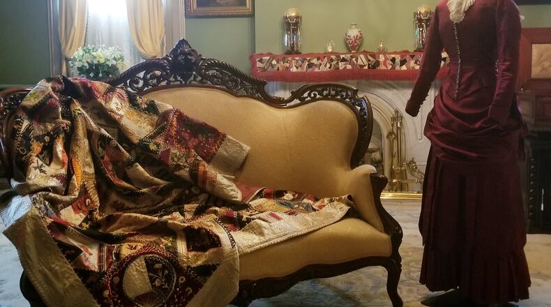 Fancy Crazy Quilt, dated 1883, is one that is paired with fashion to show that sources of quilting fabric were textiles manufactured for clothing. The outfit on the mannequin is an 1883 high school graduation dress. CONTRIBUTED