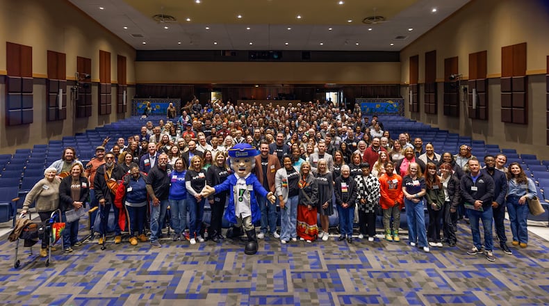 Participants poses for a photo during the 2025 Hamilton Neighborhoods Summit. The event is expected to garner more than 400 participants for this year's installment at Hamilton High School March 7. CONTRIBUTED