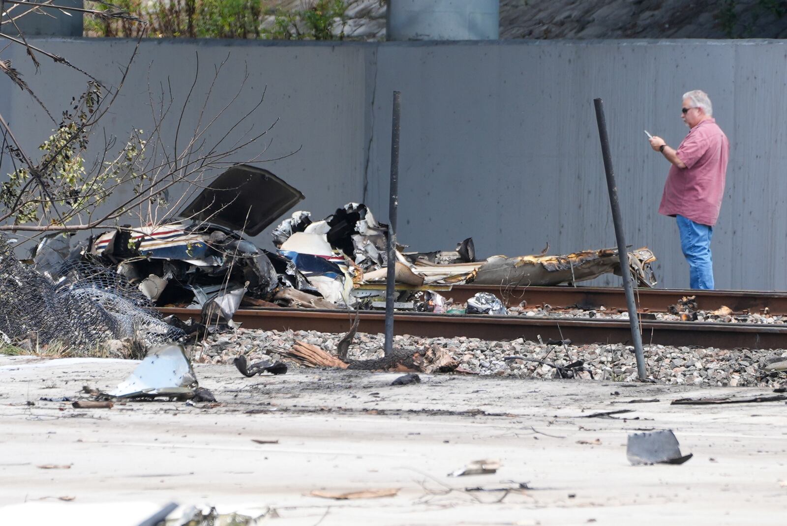 Emergency crew inspects the site of a small plane crash Friday, April 11, 2025 in Boca Raton, Fla. (AP Photo/Marta Lavandier)