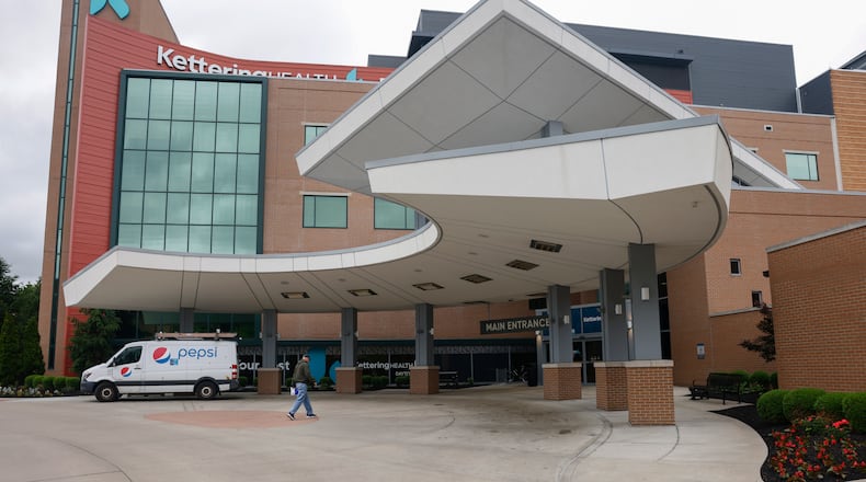 A man prepares to enter Kettering Health Dayton on Thursday, May 22, 2025. JOSEPH COOKE/STAFF