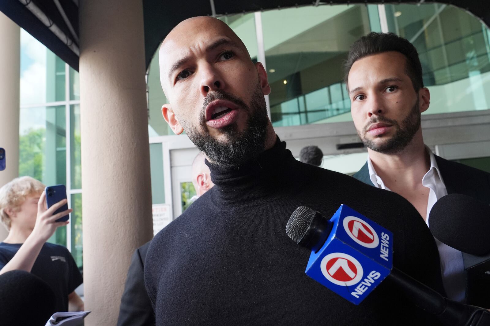 FILE - Influencer brothers Andrew and Tristan Tate arrive, Thursday, Feb. 27, 2025, in Fort Lauderdale, Fla. (AP Photo/Marta Lavandier, File)