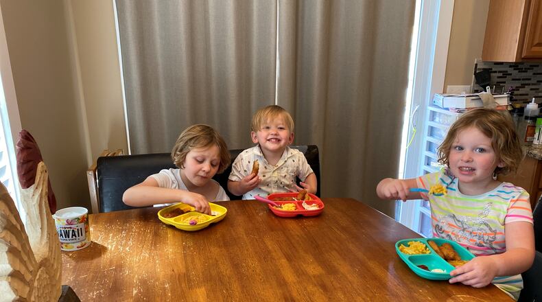 Alexis (from left), Bentley and Chloe Becker eat lunch during their break from school. Their mom, Tiffany plans their meals a week in advance to save prep time. CONTRIBUTED