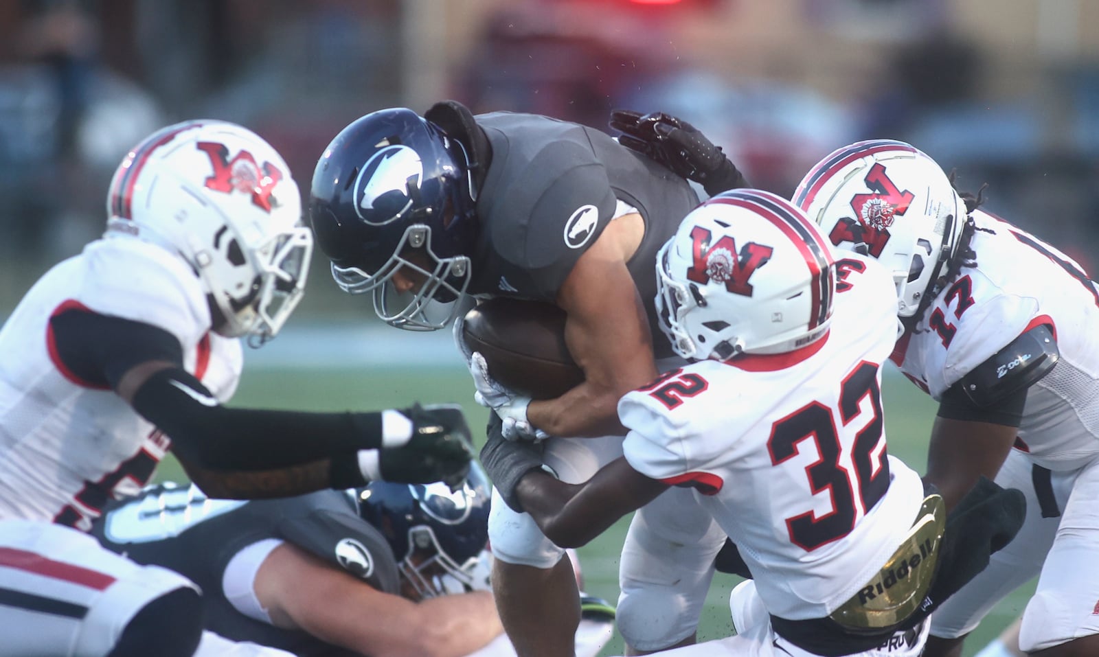 Wayne's Logan Doty runs against Fairmont on Friday, Sept. 19, 2025, at Roush Stadium in Kettering. David Jablonski/Staff