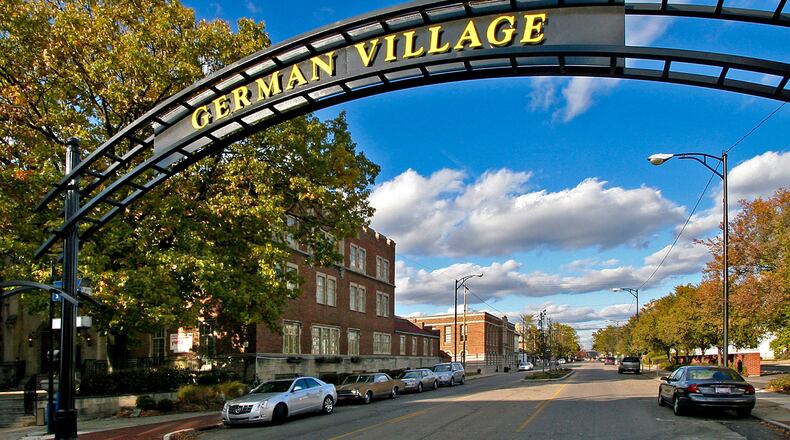 German Village this year celebrates its 50th anniversary of being a neighborhood in the city of Hamilton, and is one of three historic neighborhoods. Pictured is the arch entering the neighborhood on North Third Street at Dayton Street. PROVIDED/PAT BROWN PHOTOGRAPHY