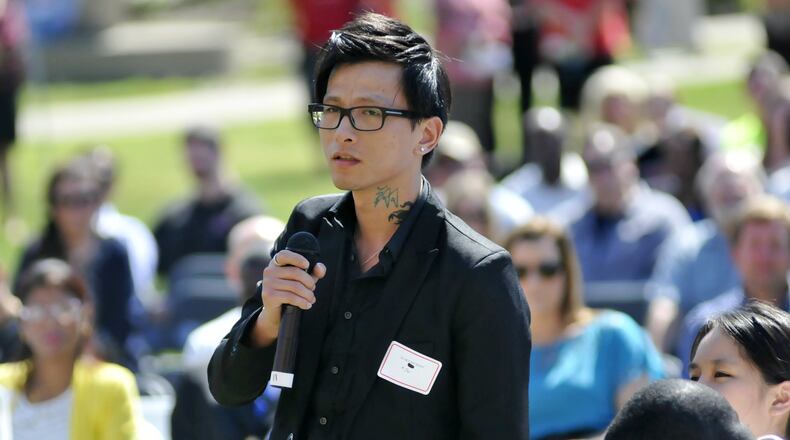 During a roll call of the 72 applicants for citizenship to the United States, Sky Shuxiang Ni, from China, states his name and country of origin during the naturalization ceremony Thursday afternoon on the campus of Miami University Hamilton.