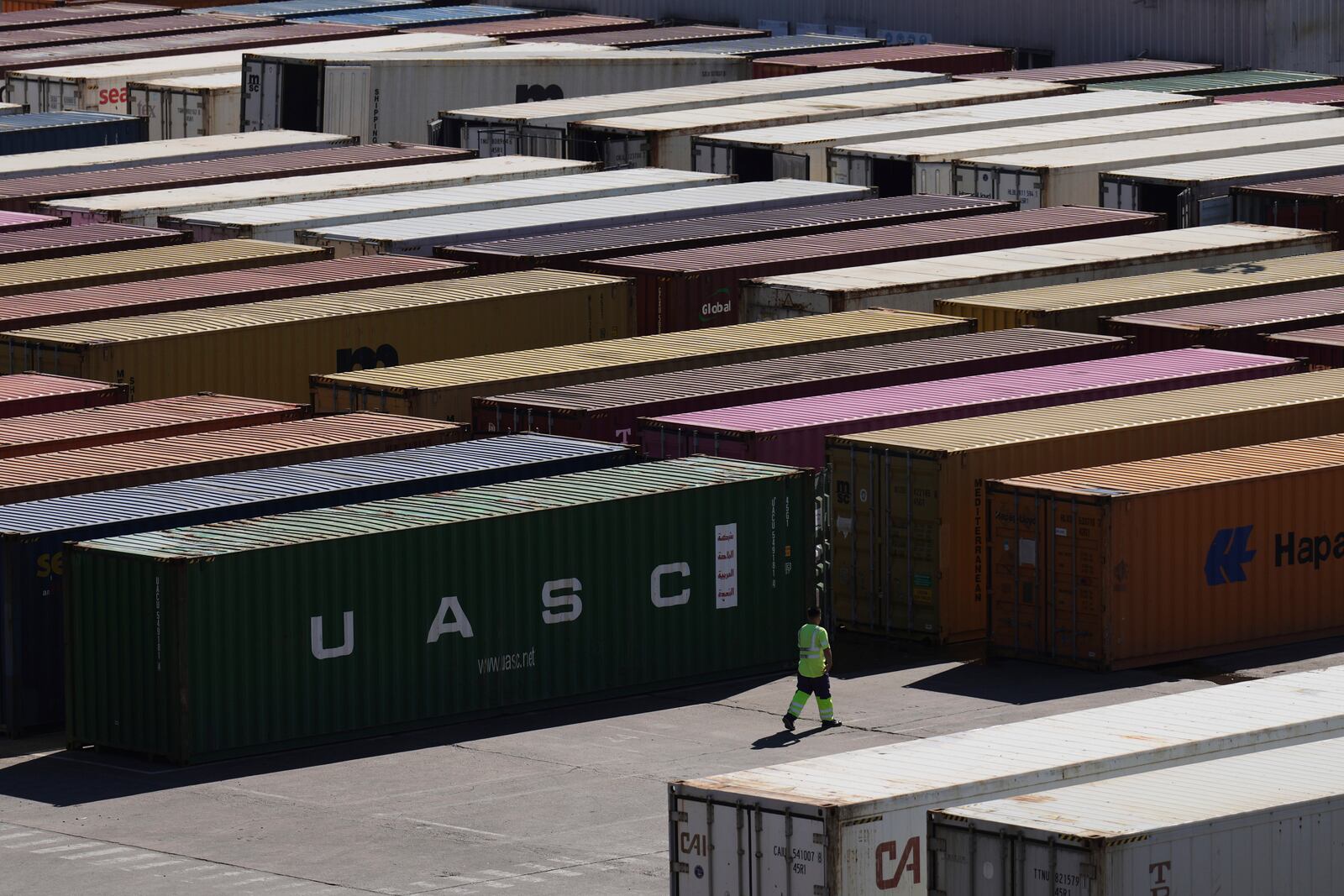 Cargo containers sit at the port in Buenos Aires, Argentina, Monday, April 14, 2025. (AP Photo/Natacha Pisarenko)