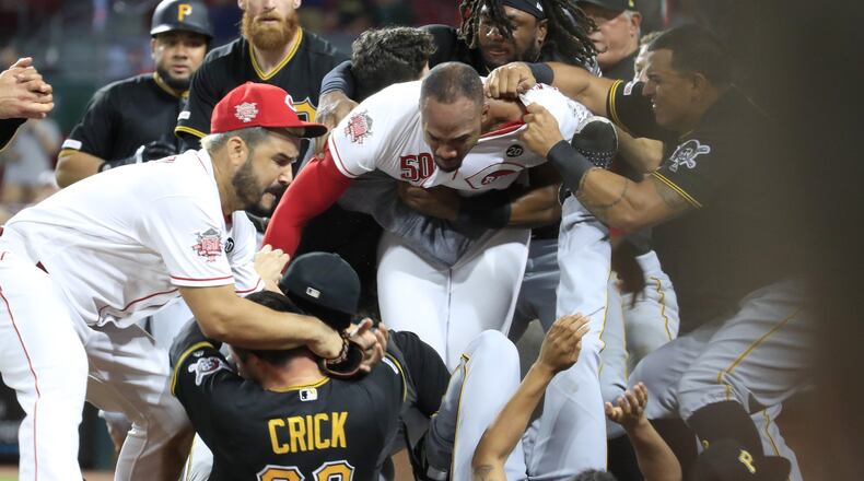 Amir Garrett (middle white shirt without hat) of the Cincinnati Reds engages members of the Pittsburgh Pirates during a bench clearing altercation in the 9th inning of the game at Great American Ball Park on Tuesday, July 30, 2019 in Cincinnati. (Photo by Andy Lyons/Getty Images)