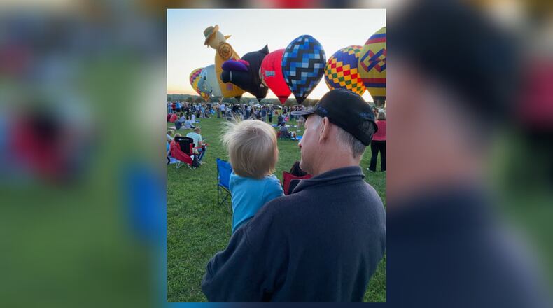 David Hiteshew and his grandson watch hot air balloons rise during The Ohio Challenge in Middletown. iSTOCK/COX