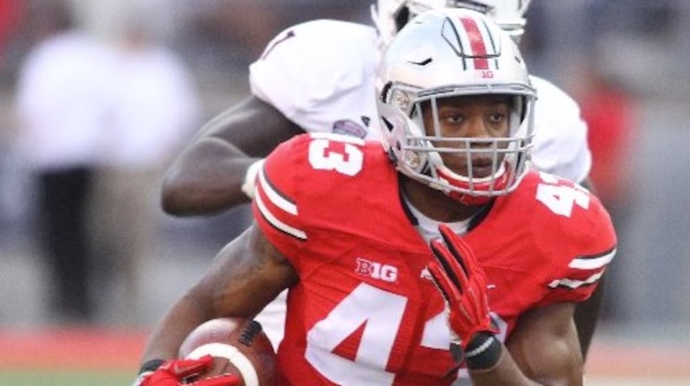 Ohio State linebacker Darron Lee returns an interception for a touchdown in the third quarter against Northern Illinois on Saturday, Sept. 19, 2015, at Ohio Stadium in Columbus. David Jablonski/Staff