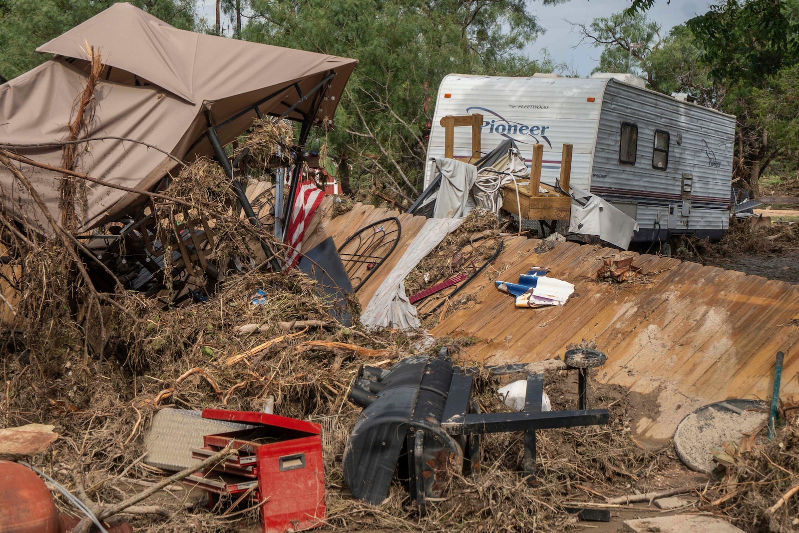 Debris from flash flooding is seen at Cedar Stays RV Park in Marble Falls, Texas, Monday, July 7, 2025. (Mikala Compton /Austin American-Statesman via AP)