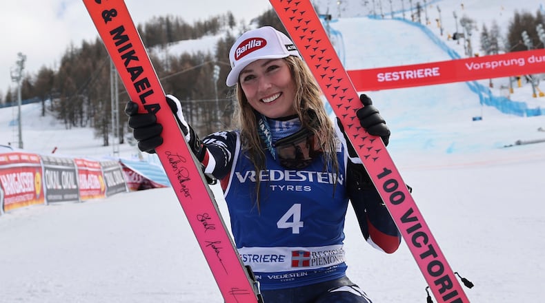 FILE - United States' Mikaela Shiffrin poses with her commemorative skis for her 100th victory after an alpine ski, women's World Cup slalom, in Sestriere, Italy, Sunday, Feb. 23, 2025. (AP Photo/Marco Trovati, File)