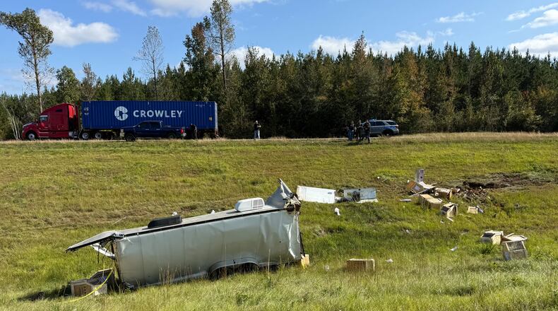 This photo provided by Scotty Ray Boyd shows an overturned truck which had been transporting several monkeys, Tuesday, Oct. 28, 2025, in Heidelberg, Miss. (Scotty Ray Boyd via AP)