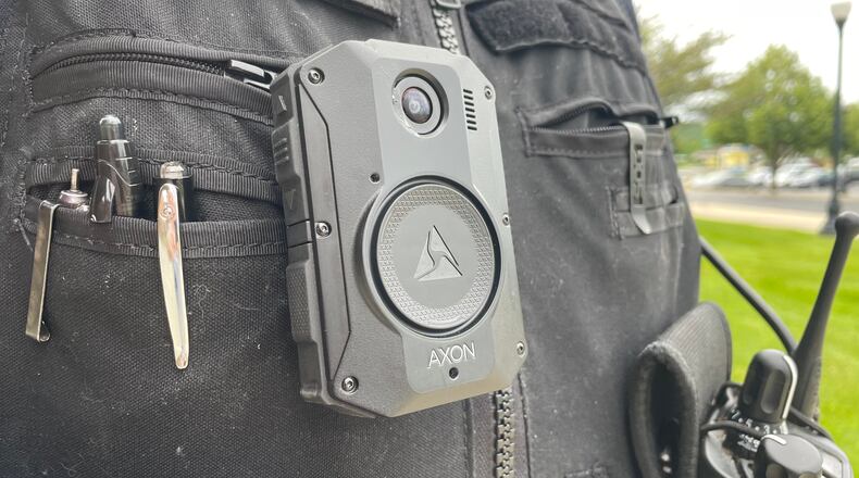The city of Hamilton is pursuing body cameras for its police force, though not all departments in Butler County have body cameras. Pictured is Officer Ryan Fleenor with the Fairfield Police Department. Fairfield has had body cameras since 2016. MICHAEL D. PITMAN/STAFF