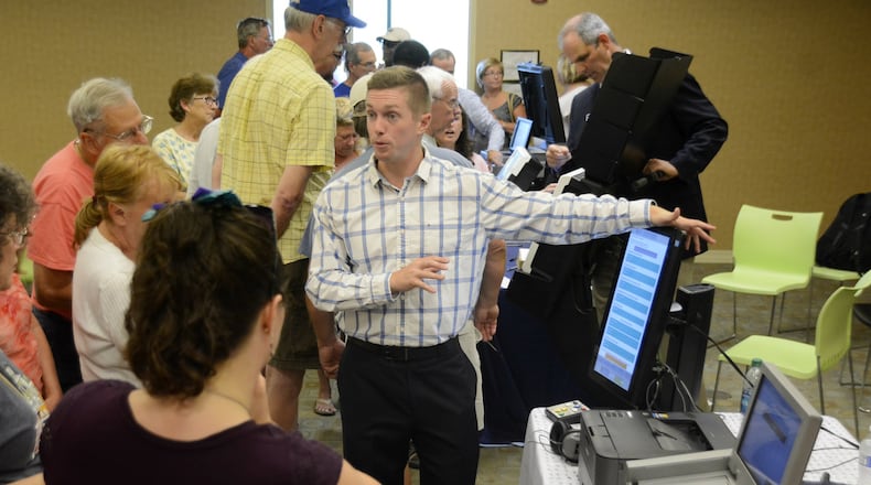 Most counties in Ohio, including Butler County, are in need of new voting machines. There is a state bill in the Ohio legislature that would pay for the lowest cost model for every county in Ohio. Pictured are Butler County residents on Wednesday, July 26, 2017, learning about one of the six voting machines vendors were displaying at the Butler County Board of Elections. vendors. The election officials said it could take between $3 million and $6 million to replace its aging equipment. MICHAEL D. PITMAN/STAFF