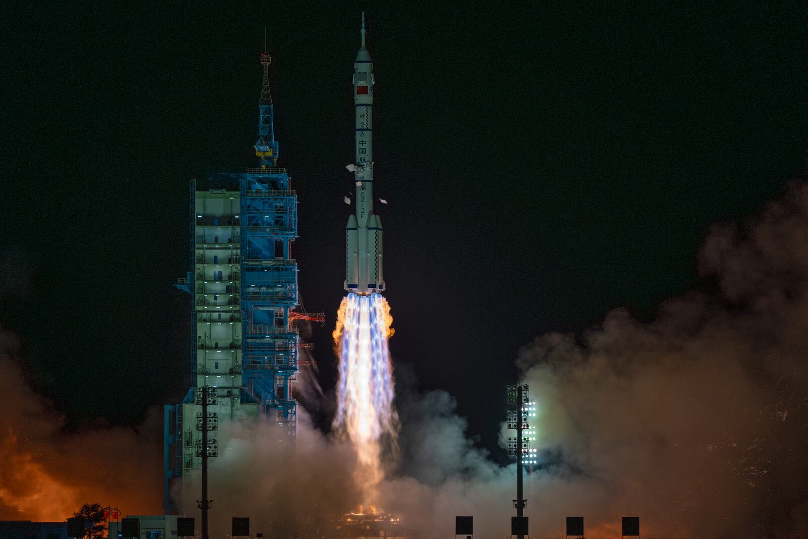 FILE -Shenzhou-19 spacecraft sitting atop a Long March rocket takes off from the Jiuquan Satellite Launch Center in Jiuquan, northwestern China in the early hours of Oct. 30, 2024. (AP Photo/Ng Han Guan, File)