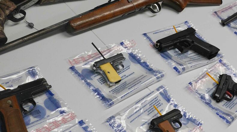 FILE - A collection of illegal guns is displayed during a gun buyback event, Saturday May 22, 2021 in the Brooklyn borough of New York. Individuals received pre-paid card payments of $25 up to $250 for firearms - with a bonus iPad for certain handguns or assault rifles, at the no-questions-asked event, co-sponsored by state and county attorney generals and the NYPD. (AP Photo/Bebeto Matthews, File)