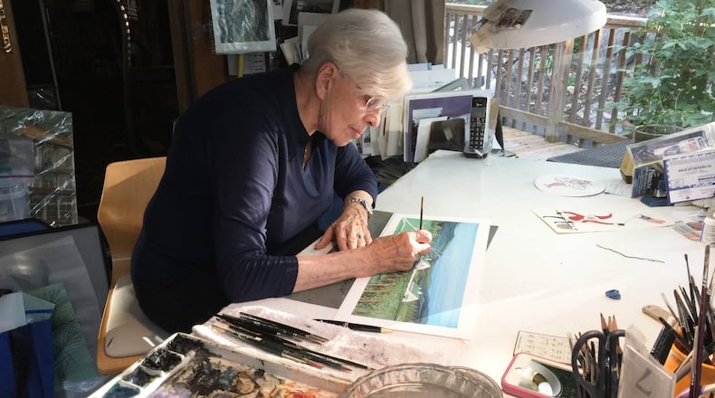 P. Buckley Moss paints in her studio in Blacksburg, Va. CONTRIBUTED