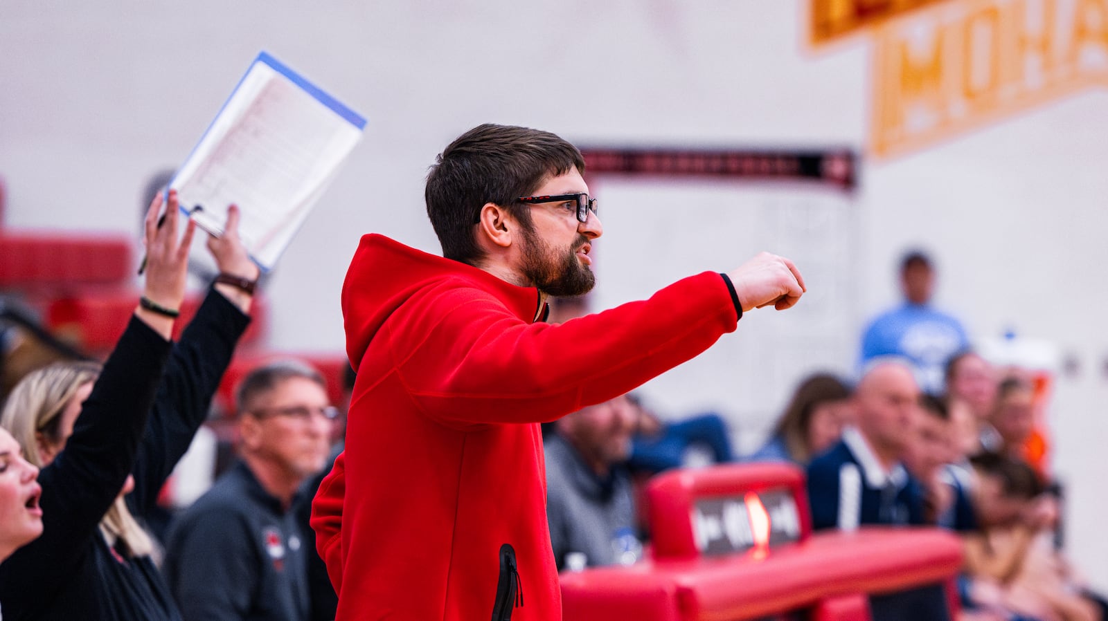 Madison girls basketball coach Tommy McGuire communicates to his players on the court during a recent game against Valley View. ELIJAH COOK / CONTRIBUTED