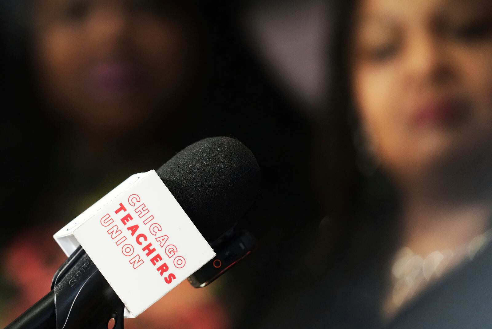 The Chicago Teachers Union logo is shown on the mic during news conference for Teachers Union to Announce Historic Contract Ratification Vote Results at CTU (Chicago Teachers Union) headquarters in Chicago, Monday, April 14, 2025. (AP Photo/Nam Y. Huh)