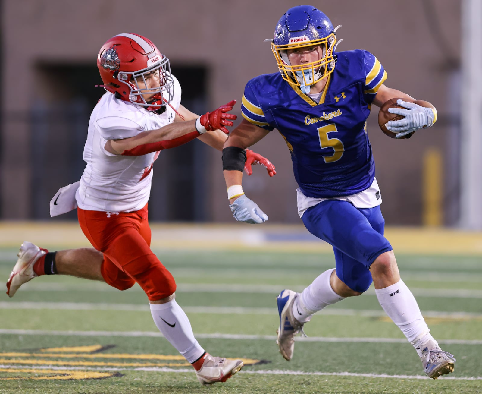 Lehman Catholic senior receiver Evan O'Leary runs with pressure from Northridge's Dylan Truesdale during a Three Rivers Conference game on Thursday, Sept. 11 at Sidney Memorial Stadium. BRYANT BILLING / STAFF
