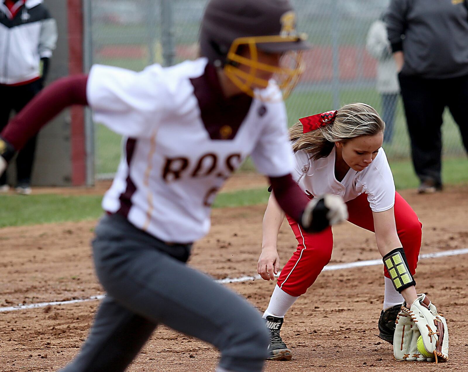 Madison third baseman Kenzi Saunders fields a bunt from Lauryn Emenaker of Ross during Saturday’s game in Ross Township. CONTRIBUTED PHOTO BY E.L. HUBBARD