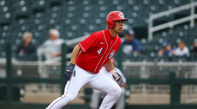 Cincinnati Reds’ Shogo Akiyama, of Japan, takes a lead off of first base during the first inning of a spring training baseball game against the Los Angeles Dodgers Monday, March 2, 2020, in Goodyear, Ariz. (AP Photo/Ross D. Franklin)