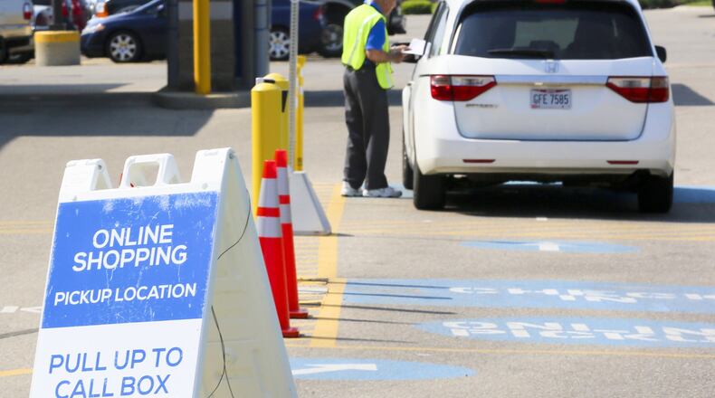 A Kroger customer picks up an online order outside the Liberty Twp. store.