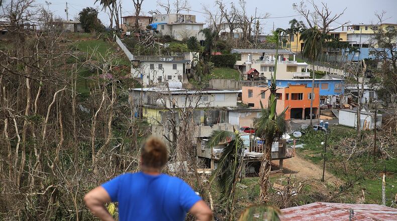 COROZAL, PUERTO RICO - SEPTEMBER 27: Irma Santiago surveys her neighborhood as people deal with the aftermath of Hurricane Maria on September 27, 2017 in Corozal, Puerto Rico. Puerto Rico experienced widespread, severe damage including most of the electrical, gas and water grids as well as agricultural destruction after Hurricane Maria, a category 4 hurricane, passed through. (Photo by Joe Raedle/Getty Images)