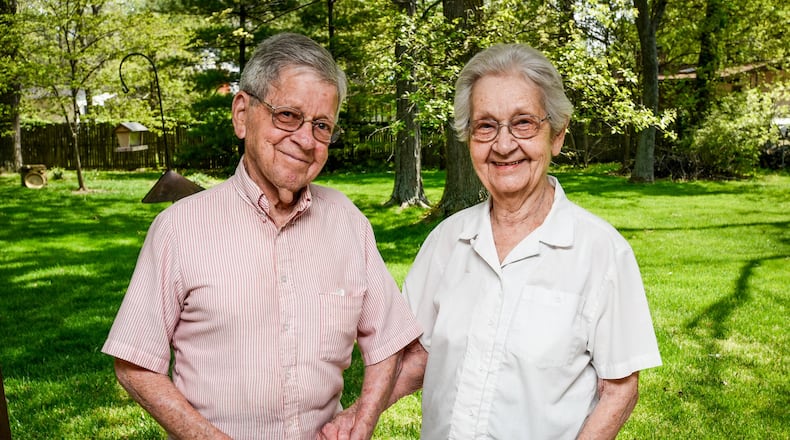 Bill, left, and Pat Williams in the back yard of their West Chester Twp. home. The couple has utilized the RASKALS (Random Acts of Simple Kindness Affecting Local Seniors) program for several years to help rake leaves and do yard clean up. RASKALS is a community service program matching local senior citizens with volunteer teams to complete simple yard clean-up chores. NICK GRAHAM/STAFF