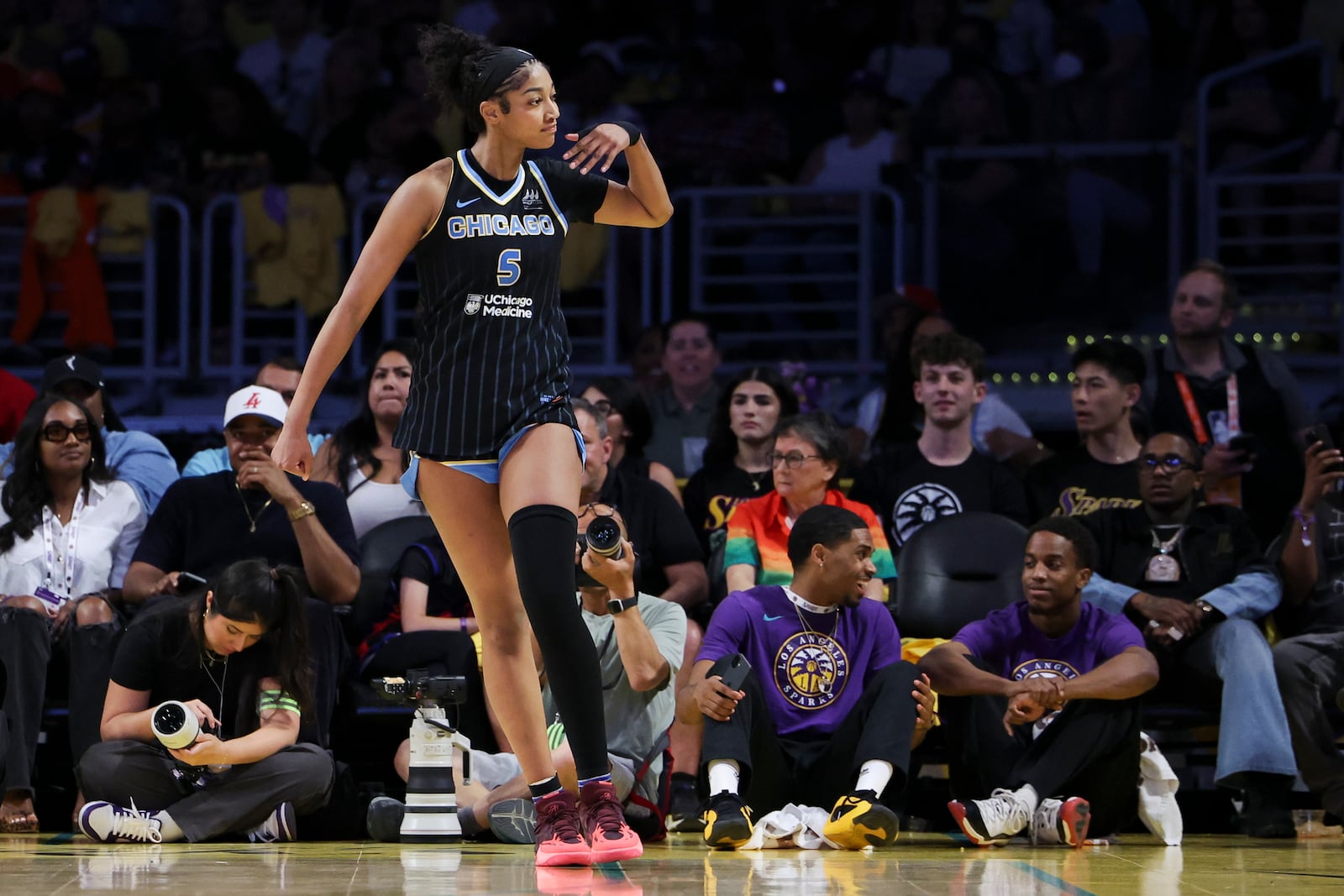 Chicago Sky forward Angel Reese gestures towards the crowd after scoring during the second half of a WNBA basketball game against the Los Angeles Sparks, Sunday, June 29, 2025, in Los Angeles. (AP Photo/Jessie Alcheh)