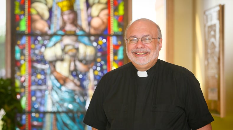 Rev. Geoff Drew of St. Maximilian Kolbe Parish in Liberty Twp. Friday, Sept. 18, 2015. GREG LYNCH / STAFF