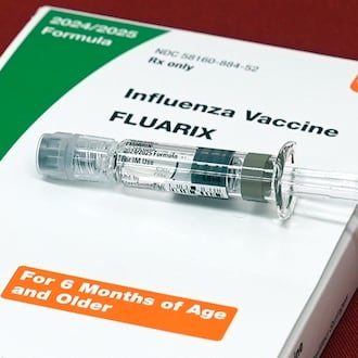 FILE - A flu vaccine is displayed at a pharmacy in New York, on Tuesday, Sept. 24, 2024. (AP Photo/Mary Conlon, File)