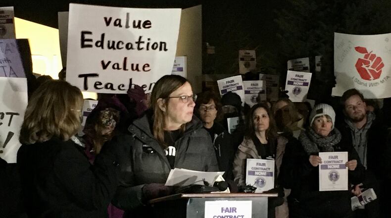 An early morning, emergency session meeting today by the Middletown school board saw members unanimously approve a new contract with the district's teachers union. The new labor pact, which comes after some of the most public and contentious demonstrations (pictured) in recent years, ends negotiations that began during the summer. (Photo By Michael D. Clark\Journal-News)