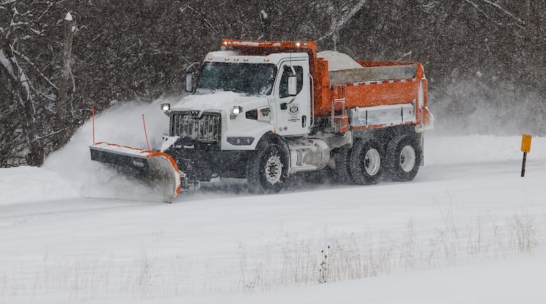 A Butler County Engineer's Office truck plows snow from Elk Creek Road Sunday morning, Jan. 25, 2026 in Madison Twp. By 10 a.m., the region had experienced nearly 12 inches of snow, with more on the way. Visit Journal-News.com for the latest snow coverage. NICK GRAHAM/STAFF