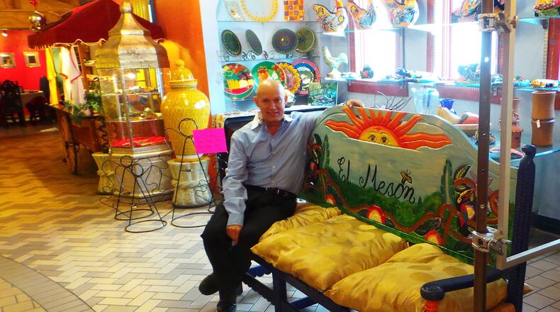 Bill Castro, co-owner of El Meson, sits in his restaurant’s market area where items including jewelry and pottery can be purchased. Contributed photo by Alexis Larsen