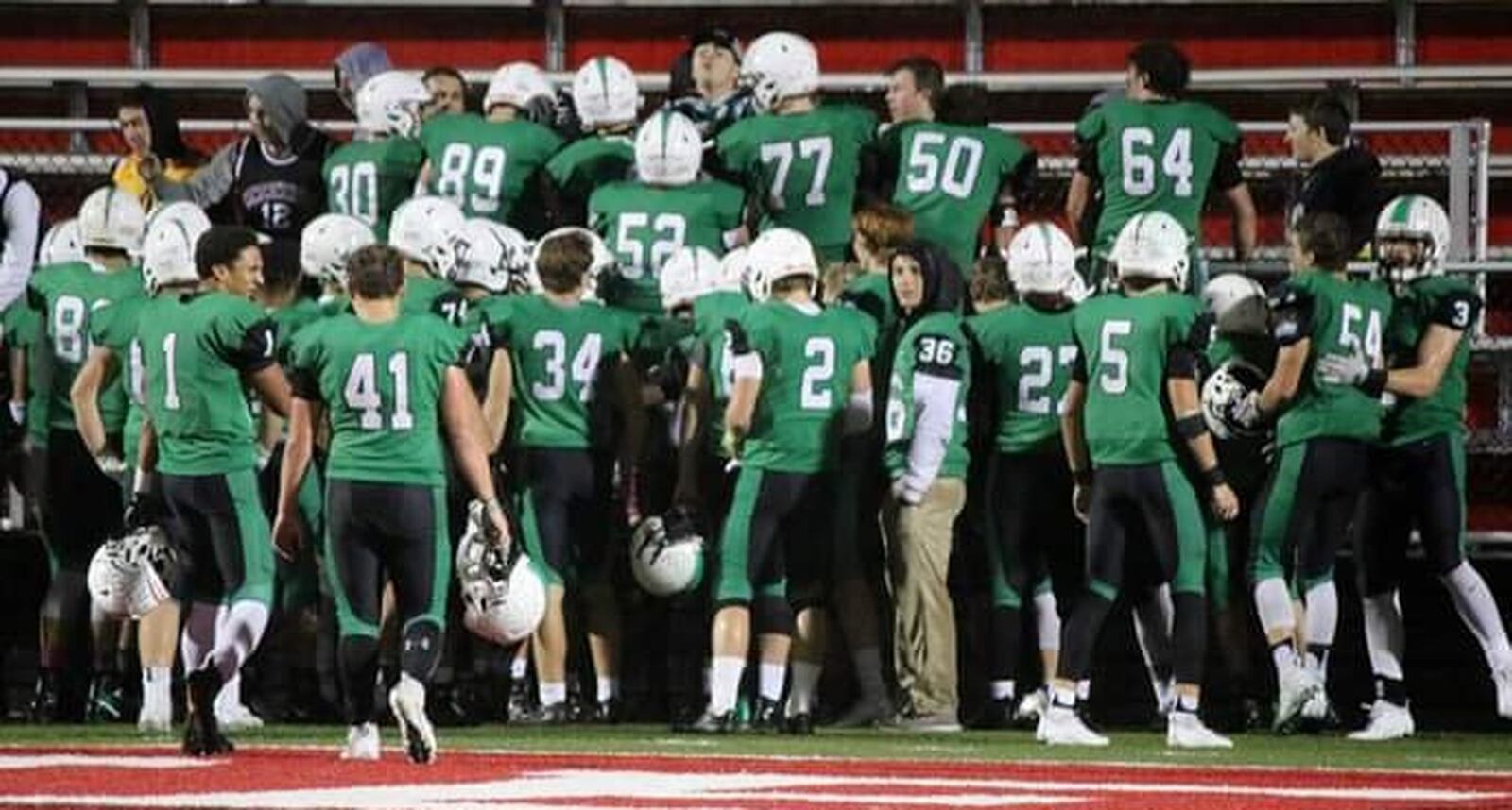 The Badin Rams celebrate with their student section after defeating Chaminade Julienne 38-21 on Friday night at Fairfield Stadium in Fairfield. CONTRIBUTED PHOTO BY TERRI ADAMS