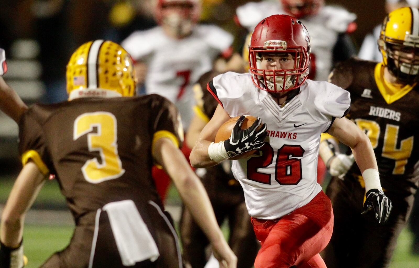 Madison’s Cameron Svarda looks for room to run against West Jefferson’s Zack Graham (3) during Friday night’s Division V, Region 20 final at Beavercreek. NICK GRAHAM/STAFF