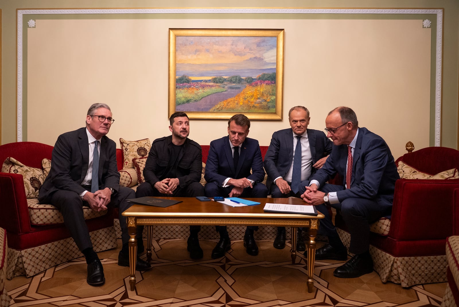 From left, British Prime Minister Keir Starmer, President Volodymyr Zelenskyy, French President Emmanuel Macron, Polish Prime Minister Donald Tusk and German Chancellor Friedrich Merz make a call to U.S. President Donald Trump from Kyiv, Ukraine, on Saturday, May 10, 2025. (AP Photo/Mstyslav Chernov)