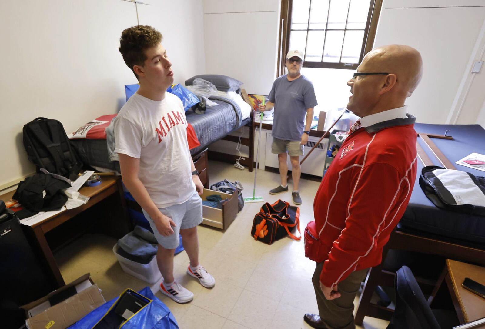 Spencer Bersh is greeted by Miami University President Greg Crawford during move in at Morris Hall Friday, Aug. 23, 2024 at Miami University in Oxford. NICK GRAHAM/STAFF