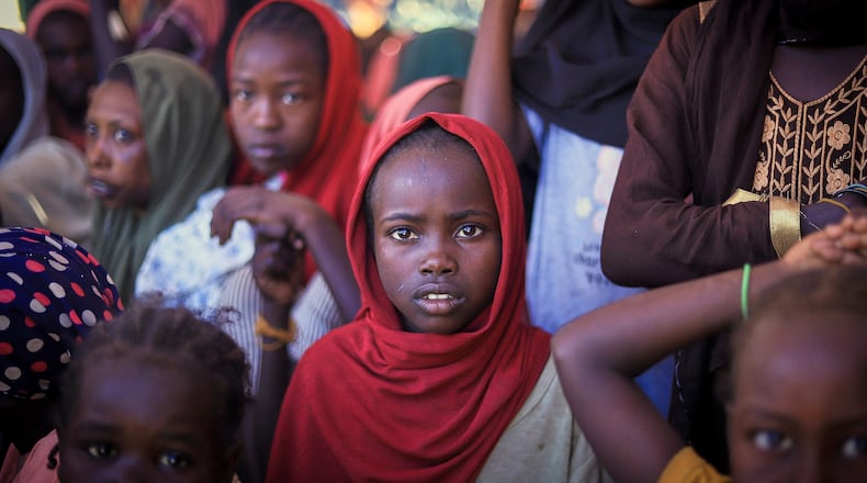 This photo released by The Norwegian Refugee Council (NRC), shows displaced women and children from el-Fasher at a camp where they sought refuge from fighting between government forces and the RSF, in Tawila, Darfur region, Sudan, Monday, Nov. 3, 2025. (Marwan Mohammed/NRC via AP)