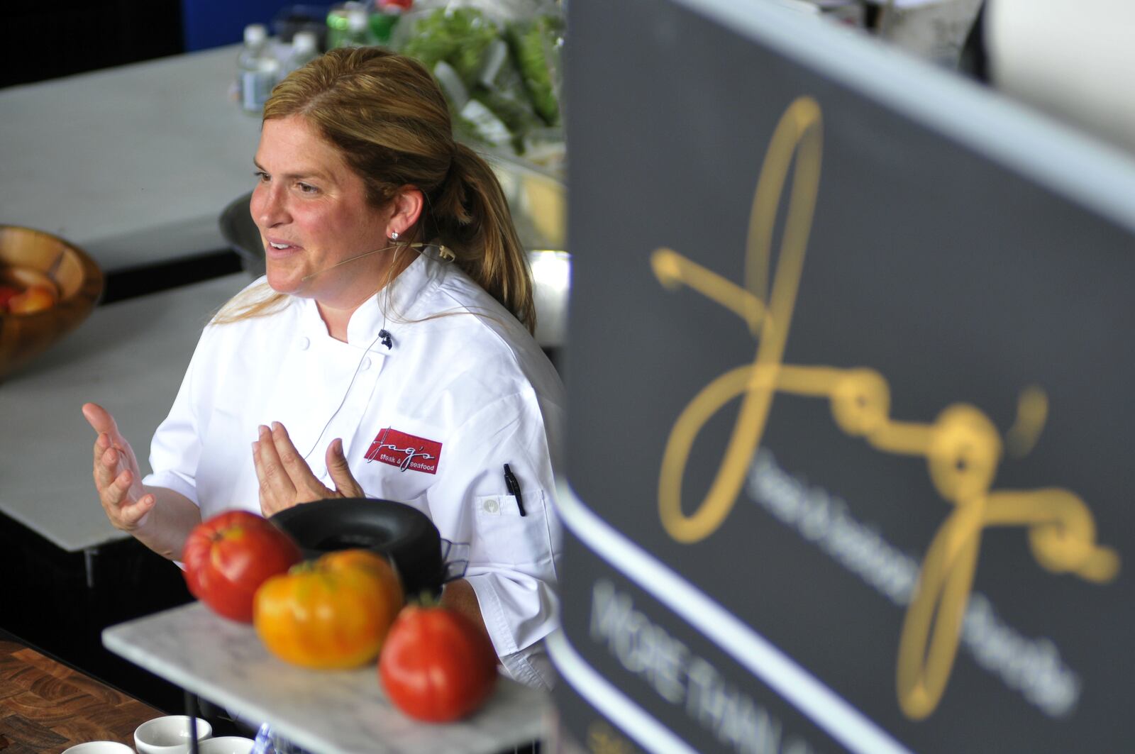 Chef Michelle Brown of Jag’s Steak & Seafood in West Chester Twp. performs a cooking demonstration in August at the Western & Southern Open in Mason. MICHAEL D. PITMAN/STAFF