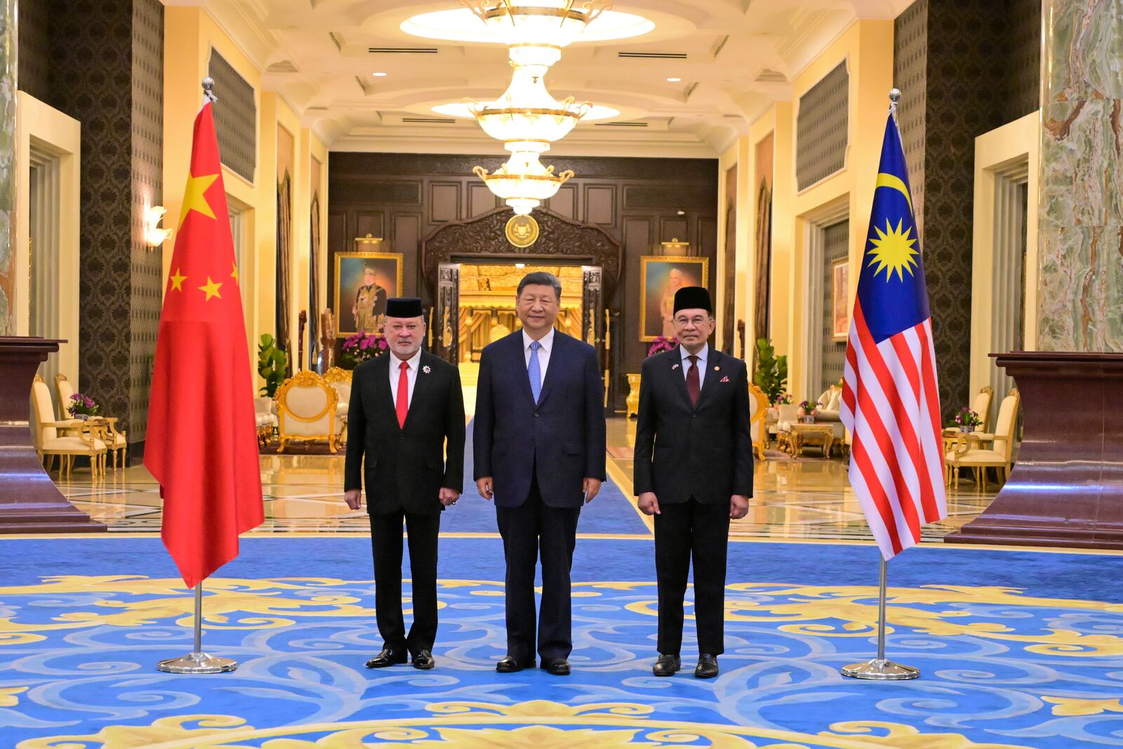 In this photo released by Malaysia's Department of Information, from left, Malaysia's King Sultan Ibrahim, China's President Xi Jinping and Malaysia's Prime Minister Anwar Ibrahim pose for a photograph after a welcoming ceremony at the National Palace in Kuala Lumpurm Malaysia Wednesday, April 16, 2025. (Azali Ariffin/ Malaysia's Department of Information via AP)