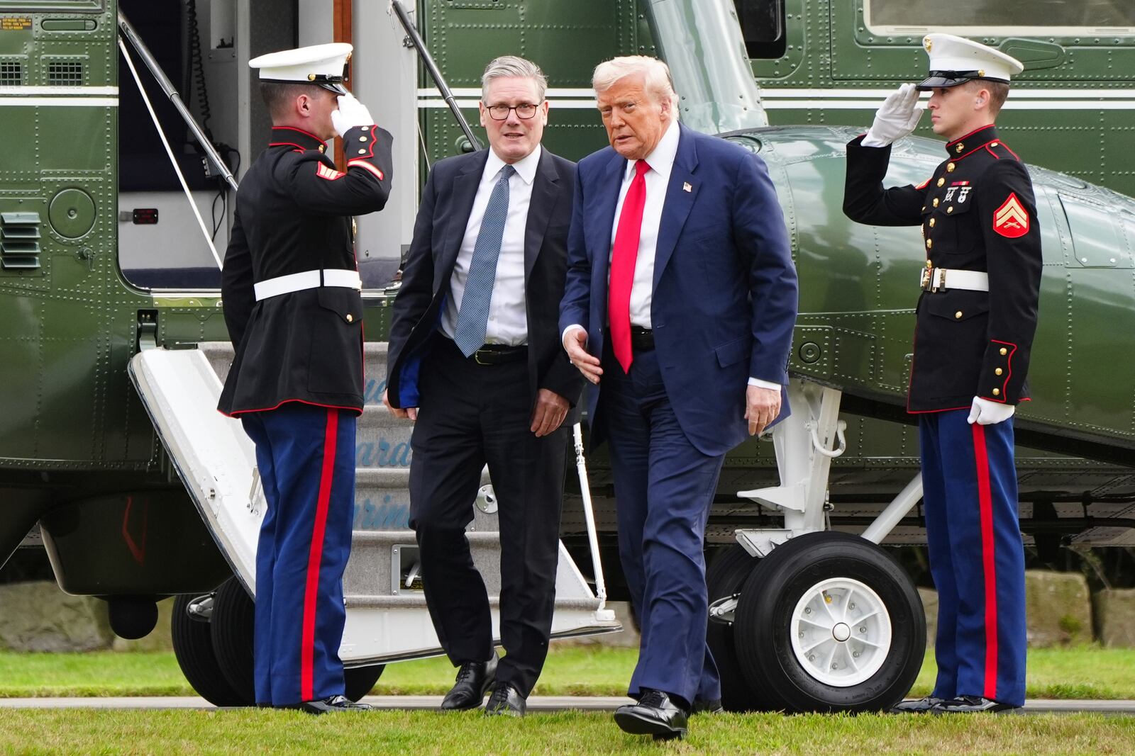 U.S. President Donald Trump, centre right, and British Prime Minister Keir Starmer arrive at Trump International Golf Links in Aberdeenshire, Scotland, Monday, July 28, 2025. (Jane Barlow/Pool Photo via AP)