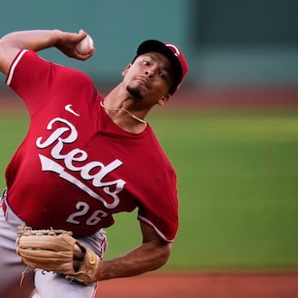 Cincinnati Reds pitcher Chase Burns delivers during the first inning of a baseball game against the Boston Red Sox at Fenway Park, Monday, June 30, 2025, in Boston. (AP Photo/Charles Krupa)