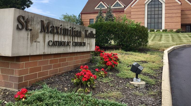 Hundreds of parishioners came to the St. Maximillian Kolbe Catholic Church in Liberty Twp. on Tuesday evening to hear the leader of the Cincinnati Archdiocese explain why a longtime pastor of the church was recently suspended. Members nearly filled every pew in the massive church with many lining up to question the handling of allegations against their former pastor, the Rev. Geoff Drew. (Photo by Michael D. Clark/Journal-News)
